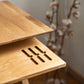 Tray detail of the Cervin Desk with a unique hourglass shape in solid oak wood