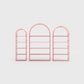 Arched bookcase Arkada, available in Switzerland through ÉTAUDORÉ, made from highest quality powdered coated steel in rose pink color