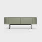 Curved Desiva Enna 01 lowboard in faded olive color steel, available in Switzerland via ÉTAUDORÉ