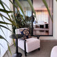 ÉTAUDORÉ Lianna side table and Reuss armchair in the winter garden of the ÉTAUDORÉ showroom in Thalwil
