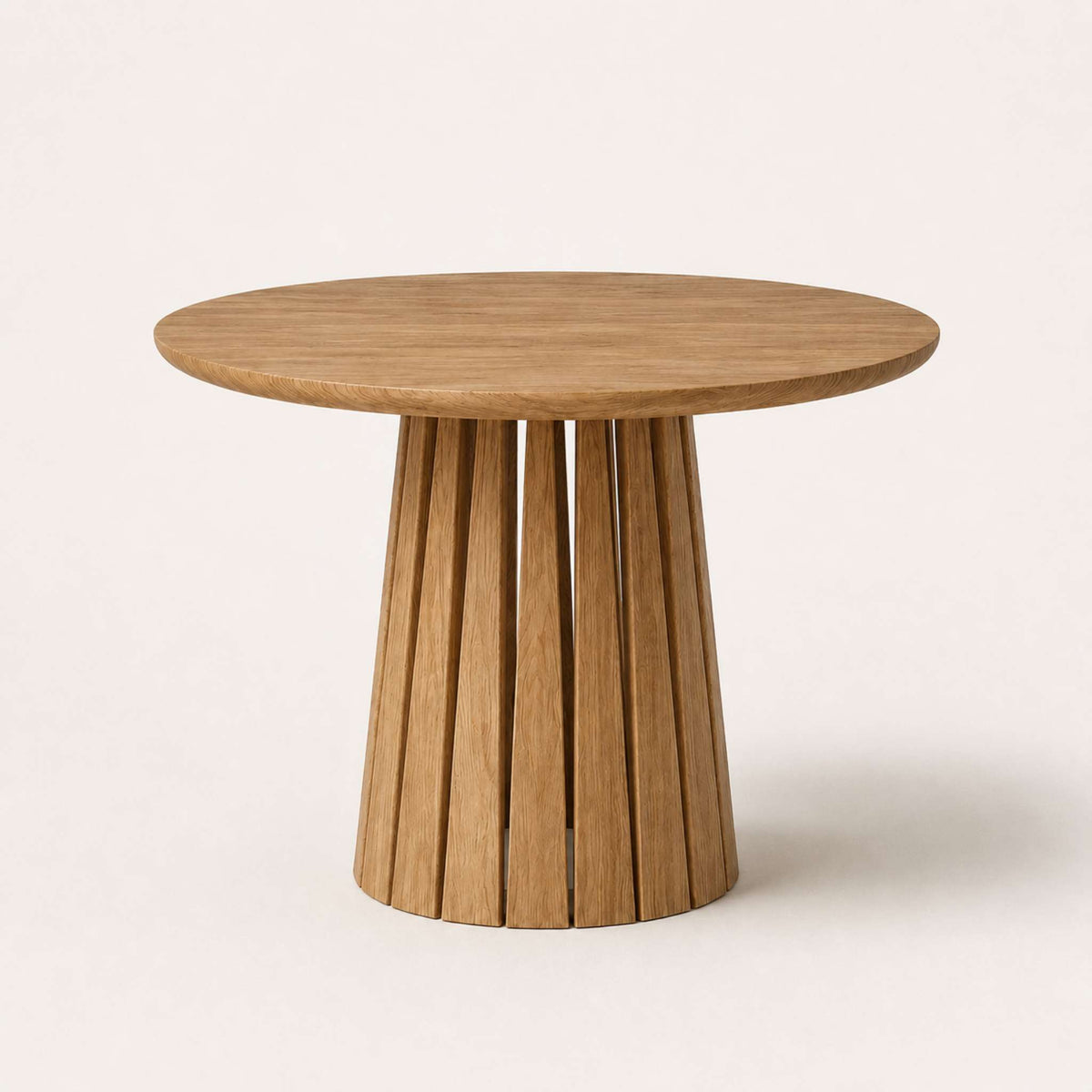 Round Rigi table from ÉTAUDORÉ in solid oak wood with a beautiful base in a medium finish